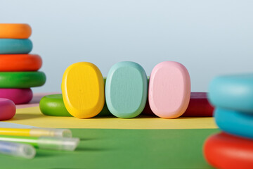 Three empty colorful blocks on a table. Wooden blocks mockup.