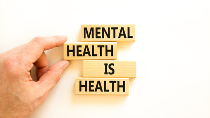 Mental health psychological symbol. Concept words Mental health is health on wooden blocks on a...