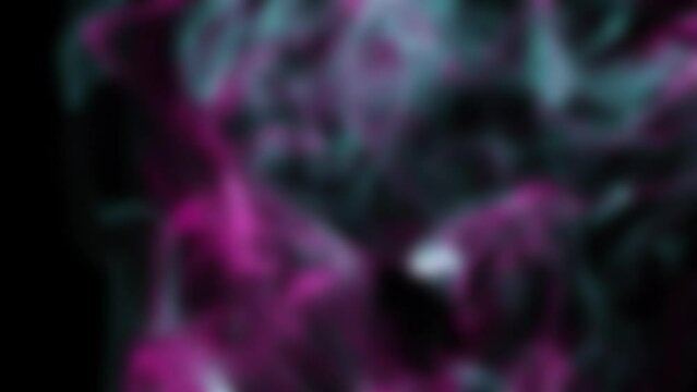 The smoke loop is purple-blue. Blurred multicolored smoke balls collide and jumble out of focus. Colorful motion design animated video background. Abstraction