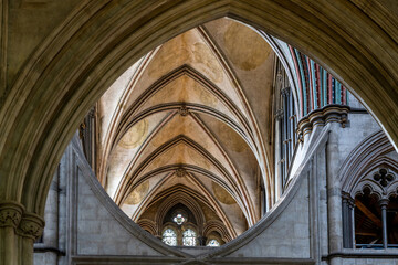 architectural detail of flowing curves and arches in Early English Gothic style inside the historic Salisbury Cathedral - obrazy, fototapety, plakaty