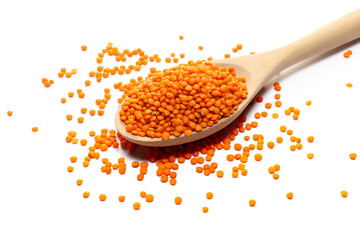 Red lentils pile in wooden spoon  isolated on white  