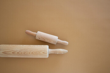 kitchen wooden dough roll on brown background