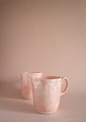 handmade. pink porcelain mug on a pink background