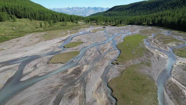 High altitude discontinuous river in valley