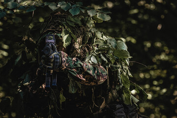 Eastern special forces soldier with rifle in woodland - 532516233