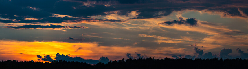 Heavenly sunset panorama. Landscape of the power of heaven and nature. Colorful and dramatic colors. Great, beautiful sky. Copy space