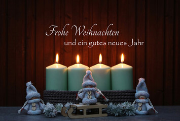 Weihnachtskarte: Kerzen mit Weihnachtsschmuck und dem Text Frohe Weihnachten und ein gutes neues...