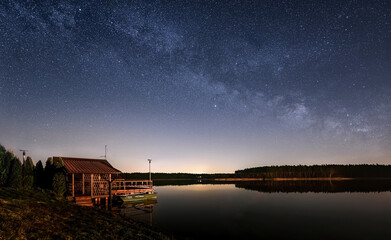 Milky way over house at the lake - 532520675