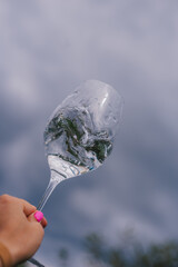 hand holding a glass of water