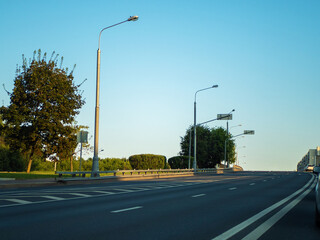 Fototapeta na wymiar Empty highway with street lamps and road markings.