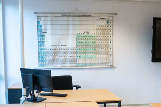 The Hague, Netherlands - September 2022: Chemistry classroom of a high school with periodic table of elements on the wall.