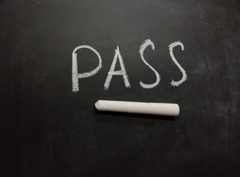 Pass word written on blackboard or slate with chalk.