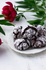 Delicious postcard with chocolate chip cookies and peonies on a white background