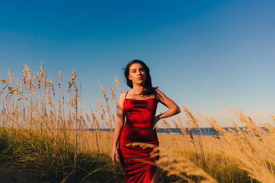 Woman Standing in Dunes At The Beach