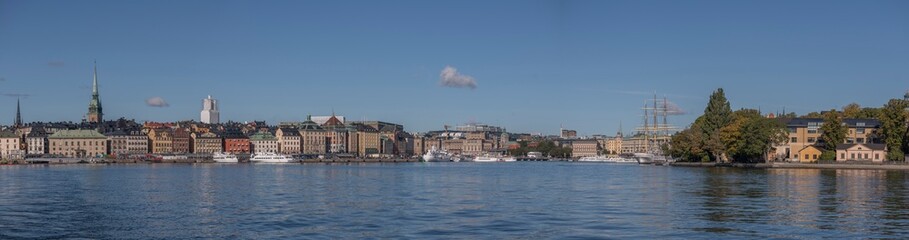 Panorama view over the bay Strömmen, archipelago commuter and the old town Gamla Stan a sunny autumn day in Stockholm