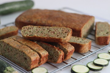 Whole wheat zucchini bread slices. Moist and dense bread made of whole wheat flour and shredded zucchini.