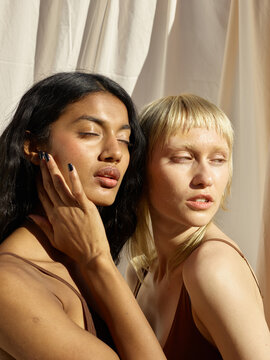 Two Ethnically Diverse Woman Blinded By The Summer Sun Portrait