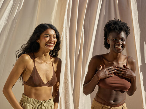 Diverse friends laughing candidly