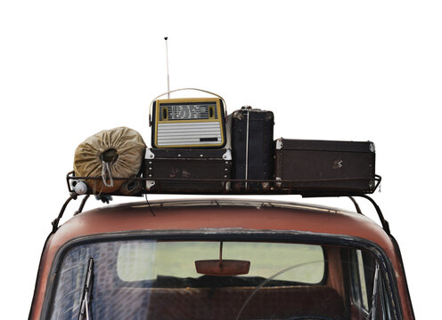 vintage travel car with suitcases and radio on roof rack in retro style isolated background png
