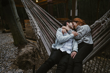 Happy couple swinging in a hammock
