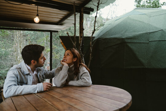 Couple In Love Sitting And Talking