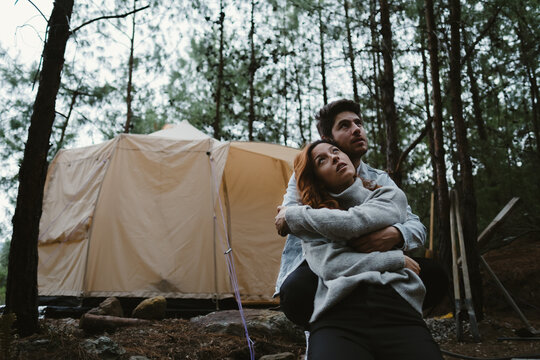 couple Looking Up At The Trees