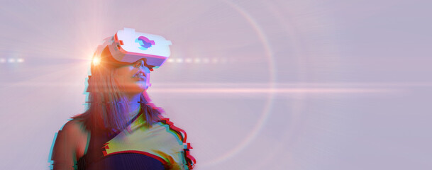 Woman is using virtual reality headset. Concept of virtual, augmented and extended reality and metaverse.