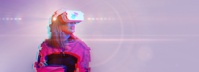 Woman is using virtual reality headset. Concept of virtual, augmented and extended reality and metaverse.