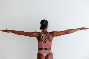 Athletic woman wearing bra and thong