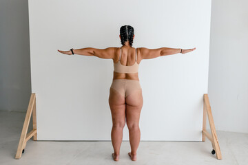 Back view of curvy female 