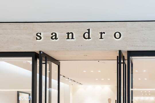 Houston, Texas, USA - February 25, 2022: Sandro store closeup sign in a shopping mall. Sandro is a clothing store that sells contemporary pieces as well as accessories, handbags and shoes.