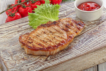 Grilled pork steak with ketchup