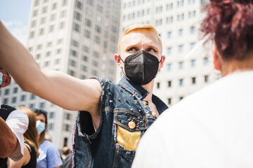 Man wearing ffp2 mask at a demonstration 