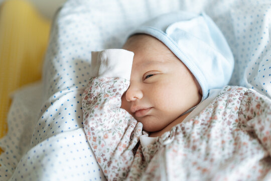 Newborn baby in his bed at home