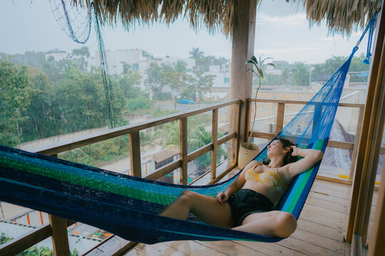 Woman resting laying on the hammock 