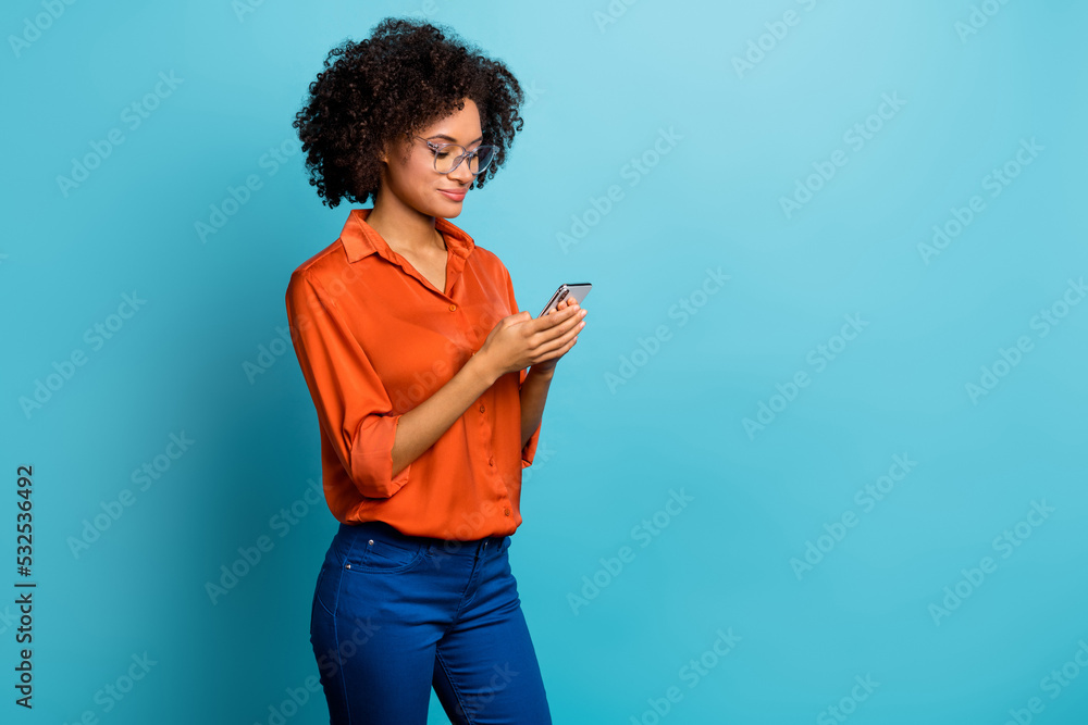 Sticker Profile side view portrait of attractive focused wavy-haired girl using gadget smm copy space isolated over bright blue color background