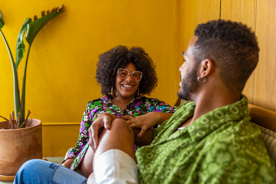 Black Couple Hanging together at home in vintage clothing 