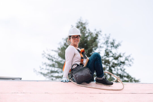 Woman Roofer On Roof Portrait