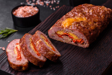 Delicious fresh ground beef meat roll with cheese, tomatoes and sweet peppers