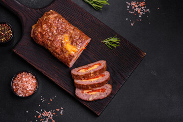 Delicious fresh ground beef meat roll with cheese, tomatoes and sweet peppers