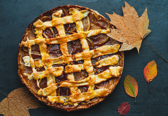 autumn pie with apples and shortbread baking dessert sweets coziness atmosphere on a black...