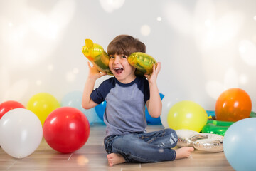 Fototapeta na wymiar Boy playing with balloons 
