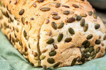 pumpkin seeds, sunflower seeds, sesame seeds, poppy seeds, seeded sliced bread loaf - 532541804