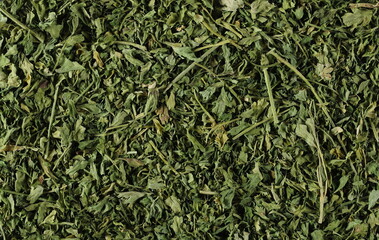Dry chopped dill background and texture, top view 