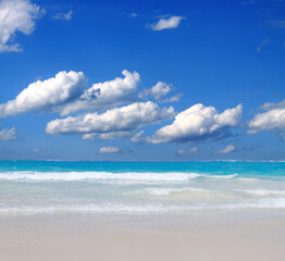 Travel background with Caribbean sea and clouds sky.