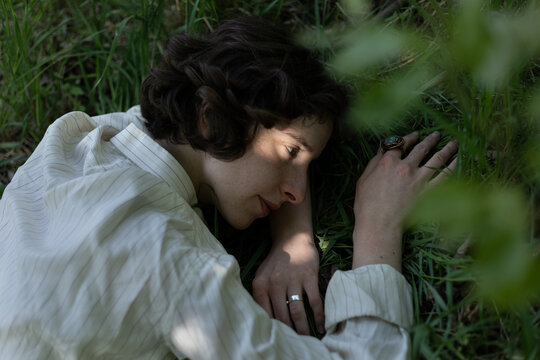 girl lies on the grass
