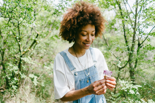 A Woman Holds Wildflowers