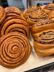 Fresh buns with poppy seeds and cinnamon