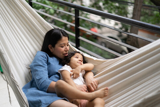 Mom and daughter on hammock.