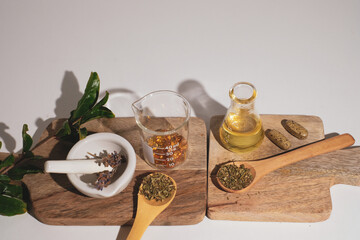 herbal medicine with pestle and mortar.capsule, oil, and tablet form with fresh herbal. Health and wellness concept